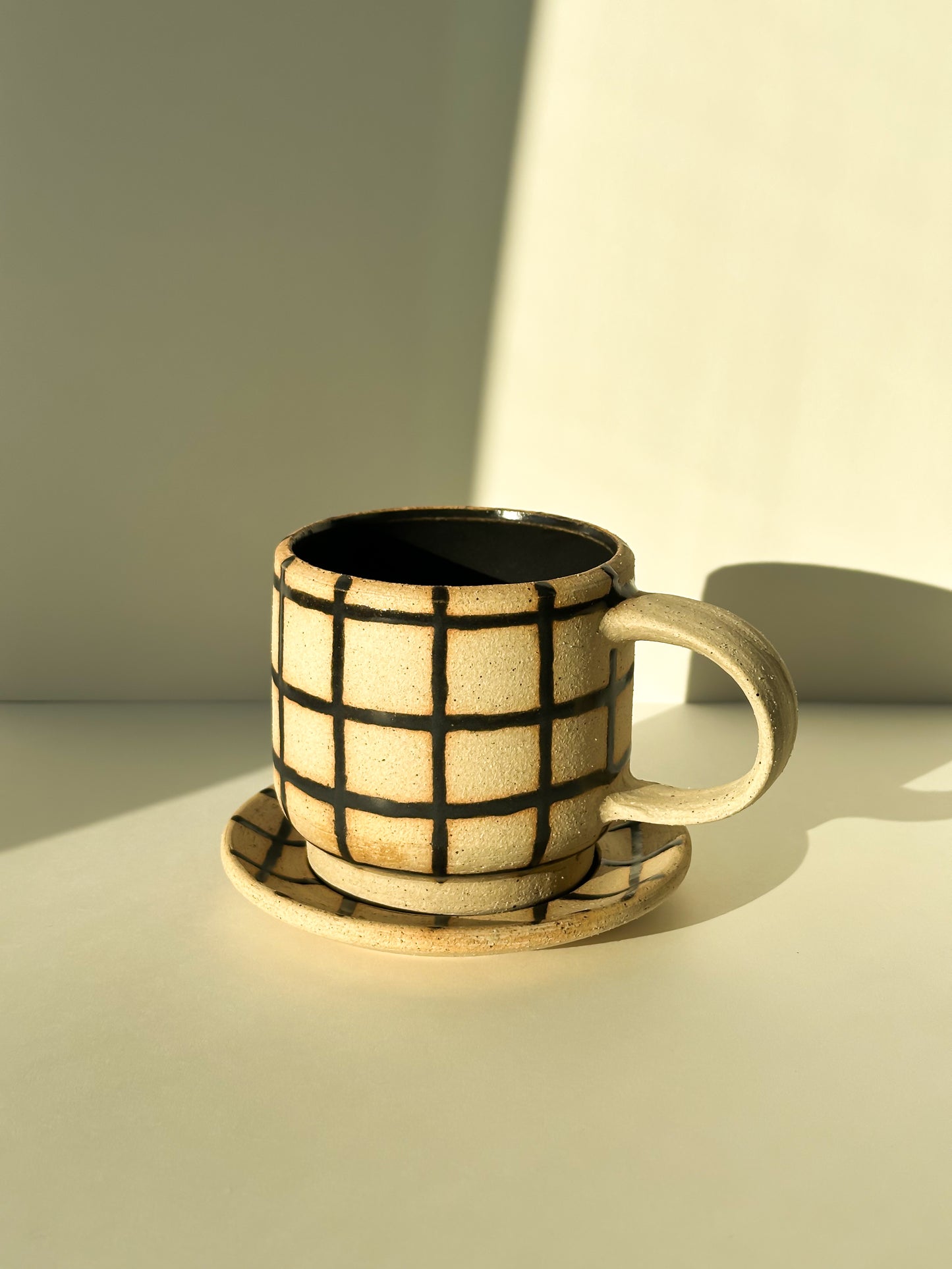 Gridded Cup and Saucer
