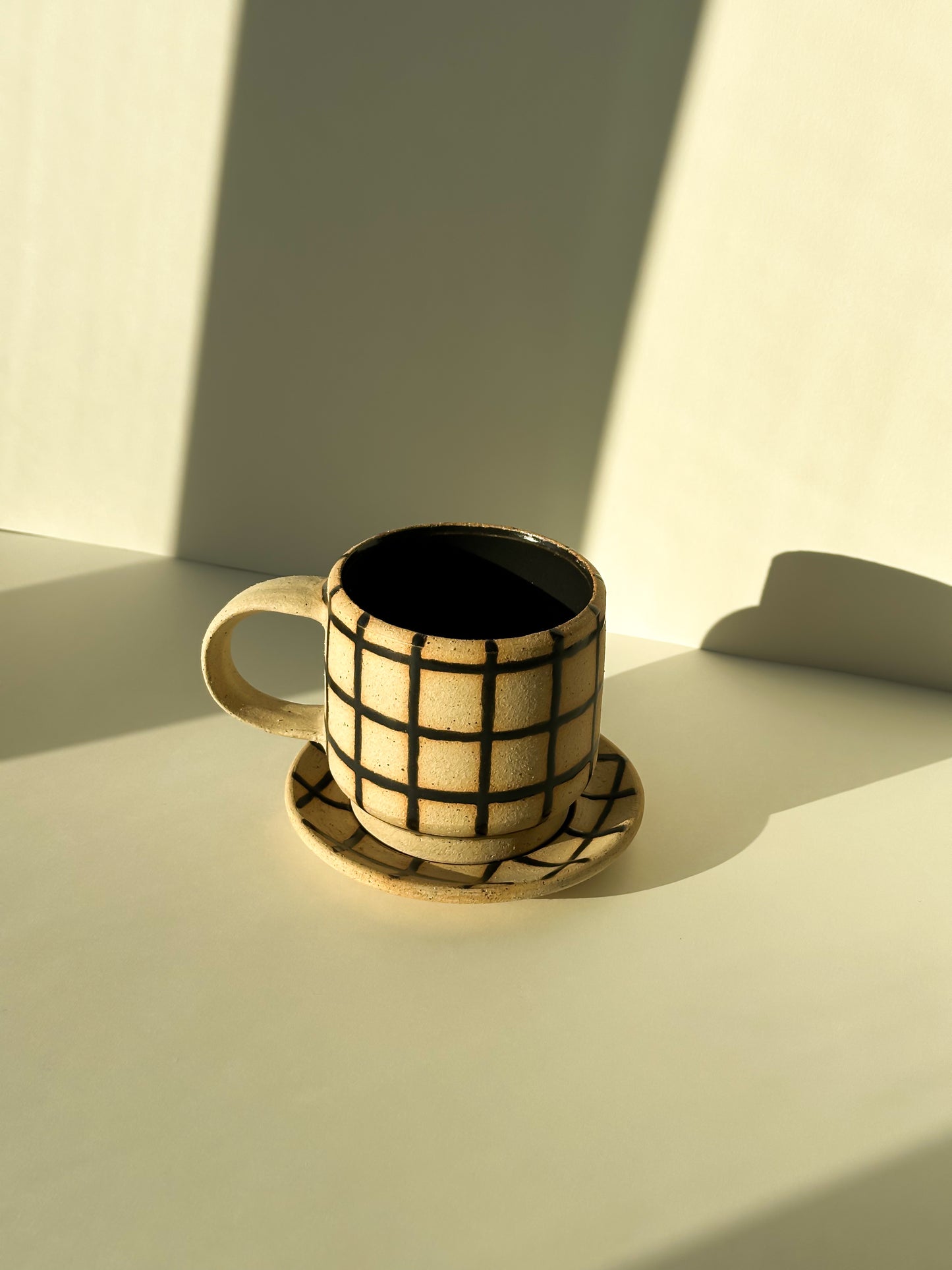 Gridded Cup and Saucer